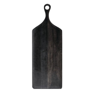 black acacia wood cutting board with a hole at the top for easy hanging in a kitchen.