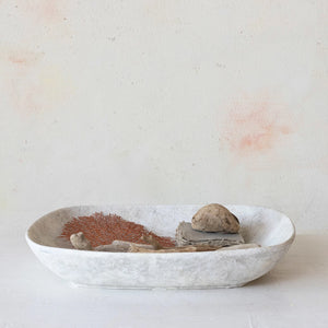 Stone tray with sticks and rocks for home decor