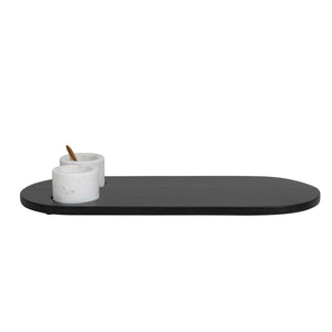 Side view of black wood tray with inset marble bowls and little gold spoon.