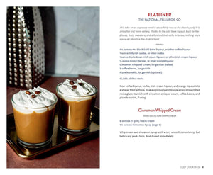 Two drinks with whipped cream on a tray, accompanied by a recipe card for 'Flatliner' cocktail.