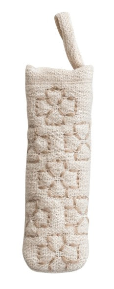 A cream-colored pot handle holder with a matching loop handle, featuring a textured geometric pattern of interlocking diamond shapes.