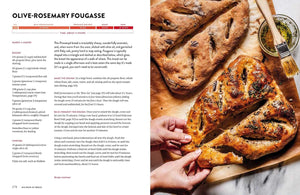 the recipe for Olive-Rosemary Fougasse. The left page contains the recipe text, ingredients, and instructions. RIght page is cooked olive rosemary bread displayed on a rustic wooden cutting board with olive oil for dip. "Big Book of Bread."
