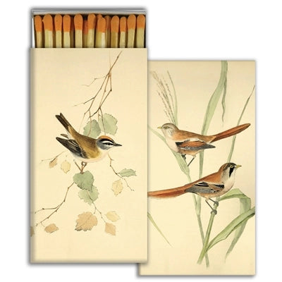 Matchbox with British bird illustrations on a beige background