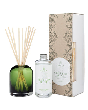 Diffuser set with bottle, reeds, and packaging labeled 'Crushed Mint' by Linnea.