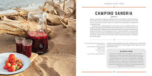 A two-page spread from "Camp Cocktails" featuring a rustic photograph of a red fruit punch called 'Camping Sangria' with strawberries and glasses on burlap next to a page of text instructions. 