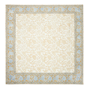 Square tablecloth with blue and gold floral pattern edge border on a beige background. Couleur Nature. 