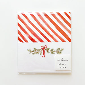 Place card with red and white striped design and decorative elements on a white background. Emily Lex Studios. 