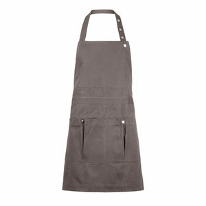Clay colored organic cotton apron with multiple pockets on a white background. The Organic Company. 
