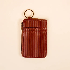 Ridged cognac brown wallet keychain displayed from back view. 