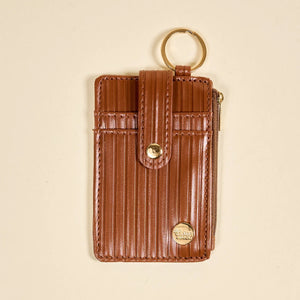 Ridged cognac brown wallet keychain displayed from front view. 