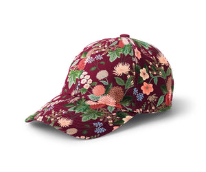 Multi colored dahlia embroidered patterned cap on a white background.