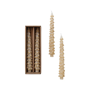 Set of decorative candles in the shape of Christmas trees, with one candle displayed outside its packaging.