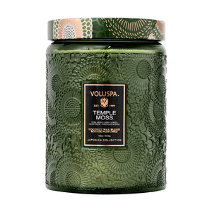 18 ounce green embossed glass jar candle in scent Temple Moss from Voluspa. 
