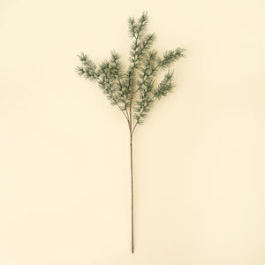 Individual faux cypress sprig displayed against neutral background. 