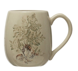 Beige mug with floral design on a white background