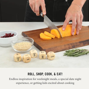 Person cutting vegetables on a wooden cutting board with dice and ingredients around.