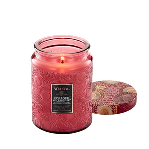 18 ounce dark mauve etched glass jar candle from Voluspa in scent Foraged Wildberry. 