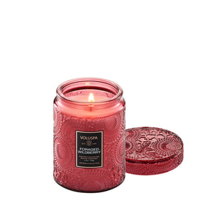 5.5 ounce mauve etched glass jar candle from Voluspa in scent Foraged Wildberry. 