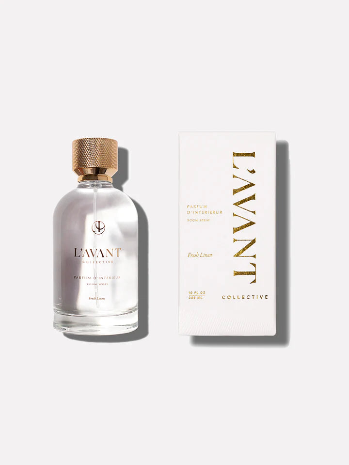 Elevated glass bottle with gold lid in LAVANT signature Fresh Linen scent room spray