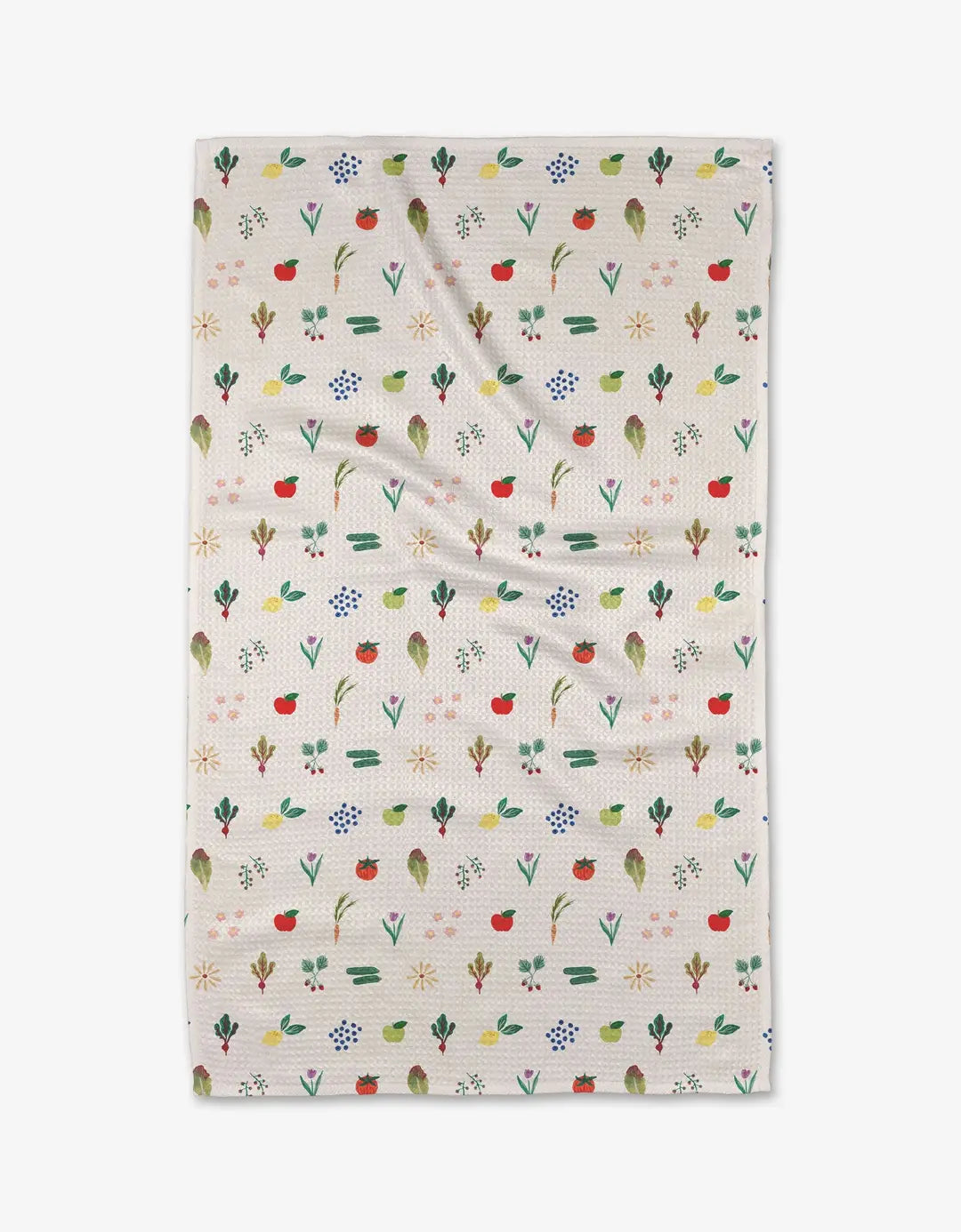 Cream colored kitchen and bathroom towel with colorful vegetable and produce pattern on a white background. Geometry House. 