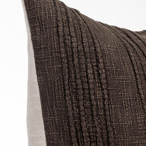 Close up view of stripe textured brown pillow on a white background. 