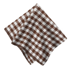 Brown and white checkered linen fabric napkin on a white background.
