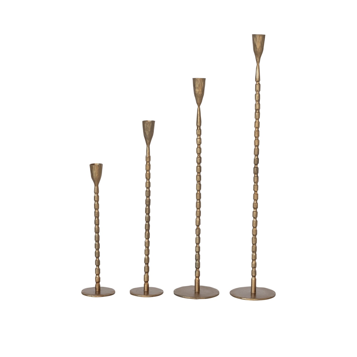 Set of four brass cast iron hammered candle holders displayed in a row. 