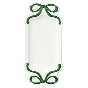 A white rectangular serving platter with scalloped edges and dark green ribbon-like decorative handles at the top and bottom, shown on a plain white background.