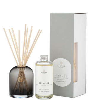 Linnea Hinoki diffuser set with bottle, sticks, and packaging on a white background
