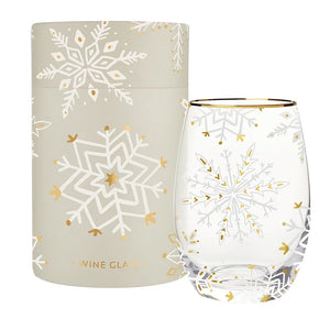 Grey and gold holiday snowflake themed stemless wine glass with matching gift box displayed against white background. Gold foiled rim. 