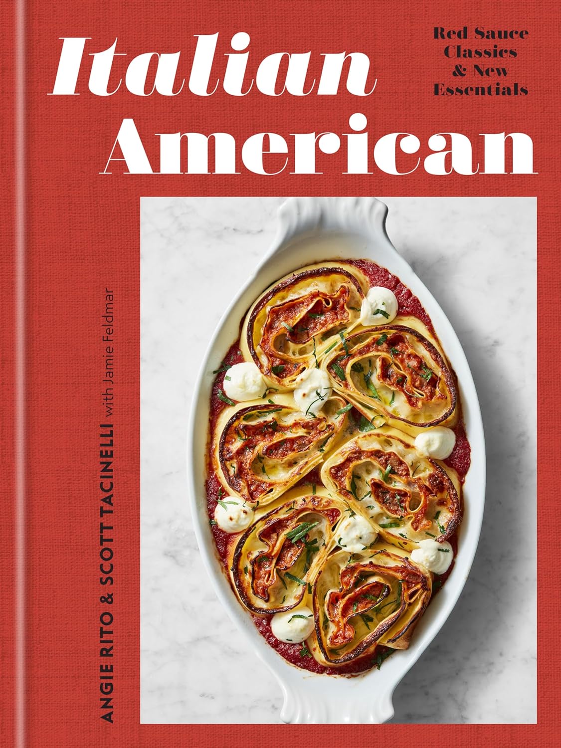 Front cover of Italian American cookbook. Pictured is a cream colored pot red sauce lasagna. Old world cooking. Family style cooking. 