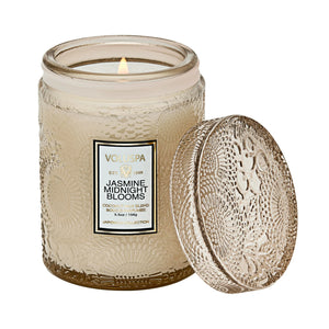5.5 ounce glass jar candle in scent Jasmine Midnight Blooms from Voluspa. 