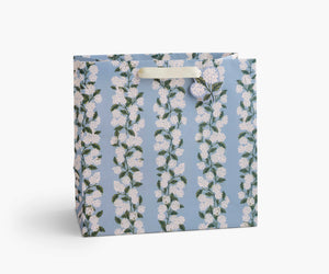 Large Light blue hydrangea patterned gift bag product packaging on a white background.
