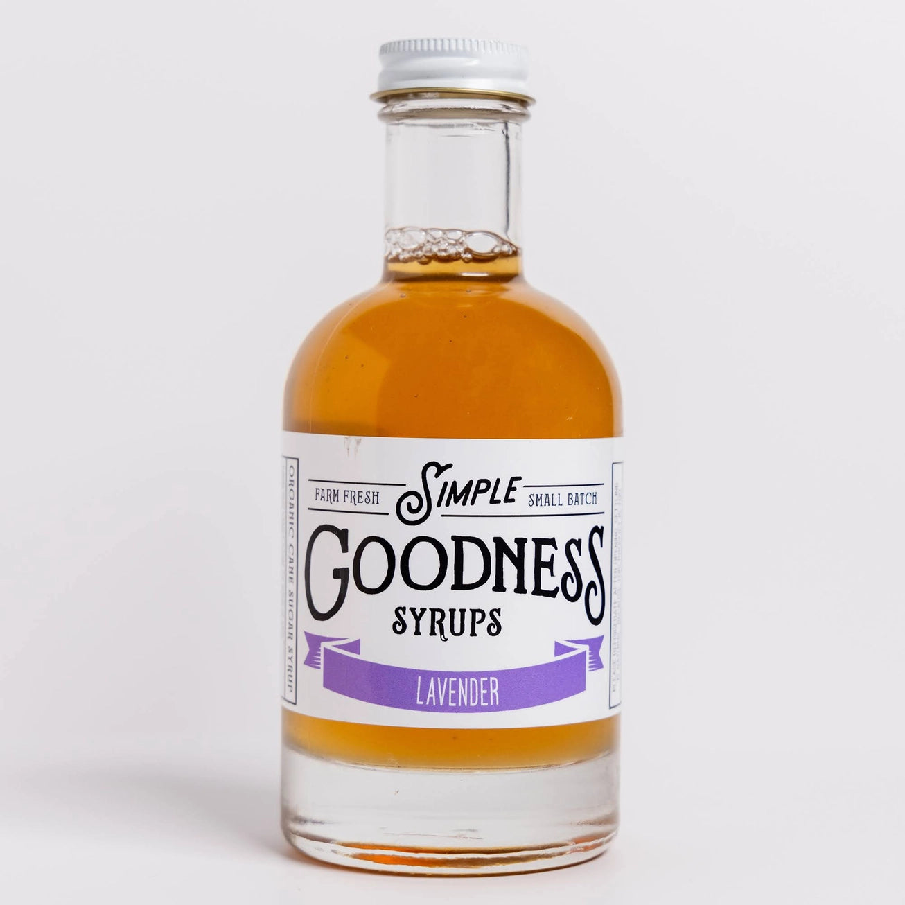 Bottle of Simple Goodness Syrups lavender flavor on a white background