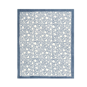 Blue and white provencal floral patterned tea towel on a white background opened. 