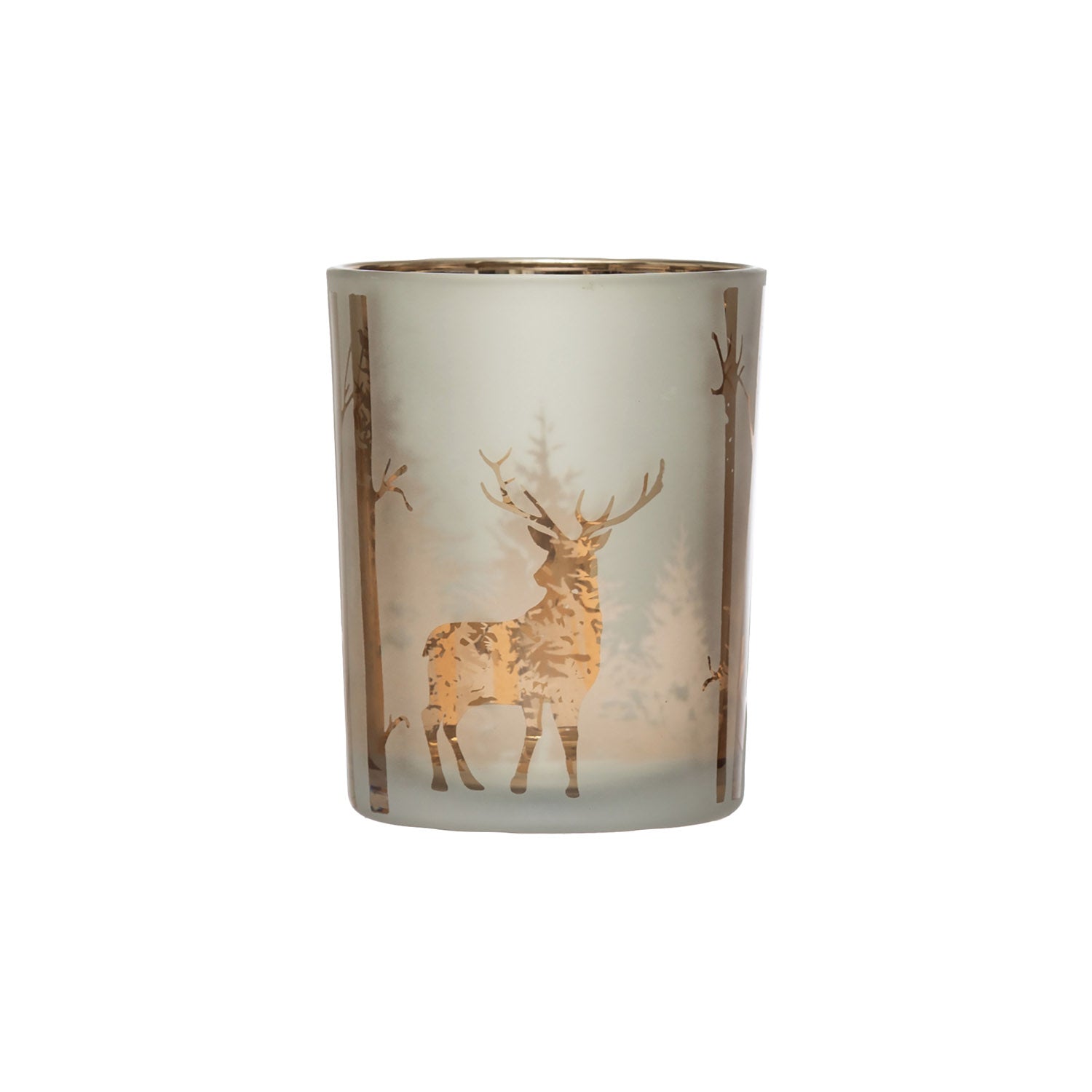 A frosted glass candle holder featuring a metallic gold deer and forest tree design, set against a plain white background. Pillar candle votive. 