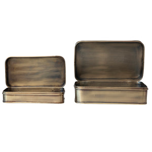 Two brass-colored metal boxes with lids displayed open on a white background 