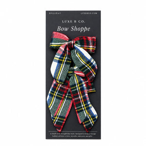 set of three mini fabric bows in traditional multi-colored plaid. 
