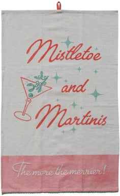 A vintage-style fabric tea towel with a festive holiday design. The towel has a beige upper section featuring the words 'Mistletoe and Martinis' in red script, a red martini glass illustration, and small green star accents.