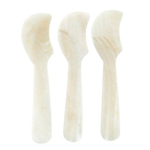 Three small curved serving spreaders made from a polished, cream-colored Mother of Pearl, arranged vertically on a plain white background. Set of three. 