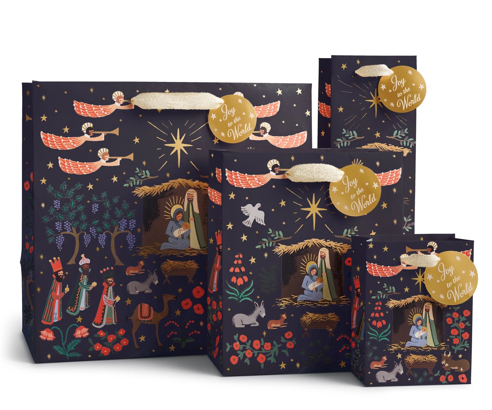 Nativity scene holiday gift bags in various sizes. Red, navy blue, gold foil accents, and shimmer gold handle ribbon.  "Joy to the World" gift tag included. Rifle Paper Co. 