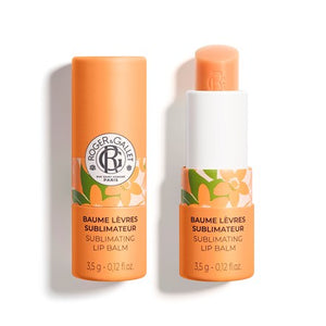 An open orange lip balm from Roger & Gallet in scent Neroli on a white background.