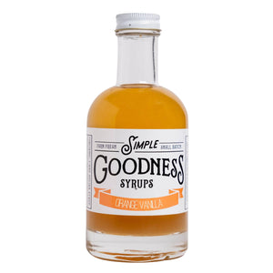 Bottle of Simple Goodness Syrups with orange vanilla flavor on a white background