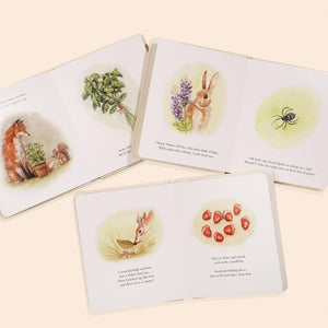 Children's book with illustrations of animals and nature on a light beige background