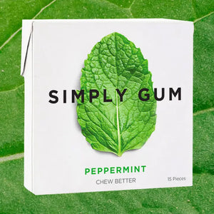 Simply Gum packaging with a peppermint leaf on a green leaf background