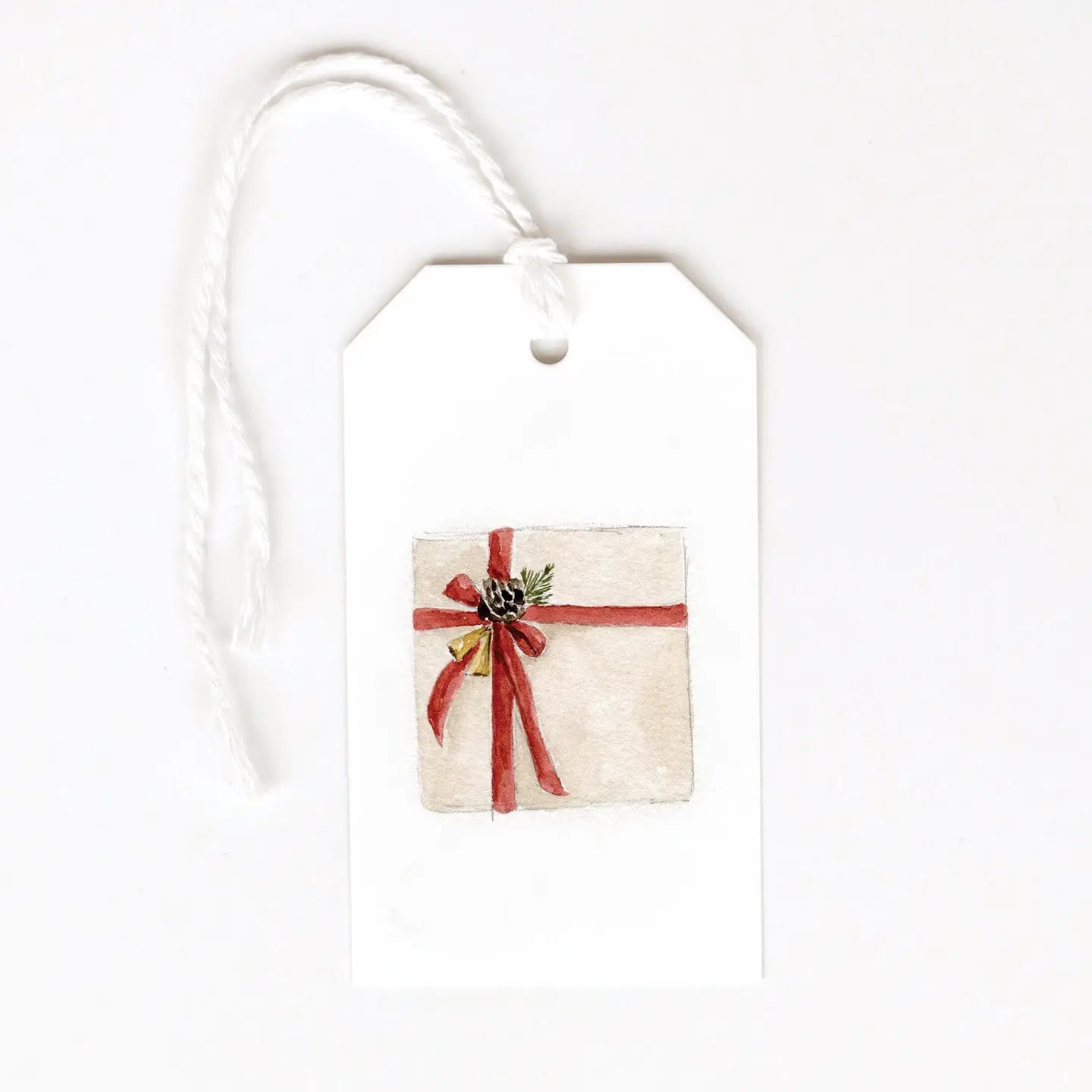 Gift tag with a red ribbon bow and pinecone design against a white background. Emily Lex Studios. 