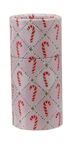 Safety holiday matches decorated with a festive Christmas pattern of red candy canes and green dotted lines on a light pink background.