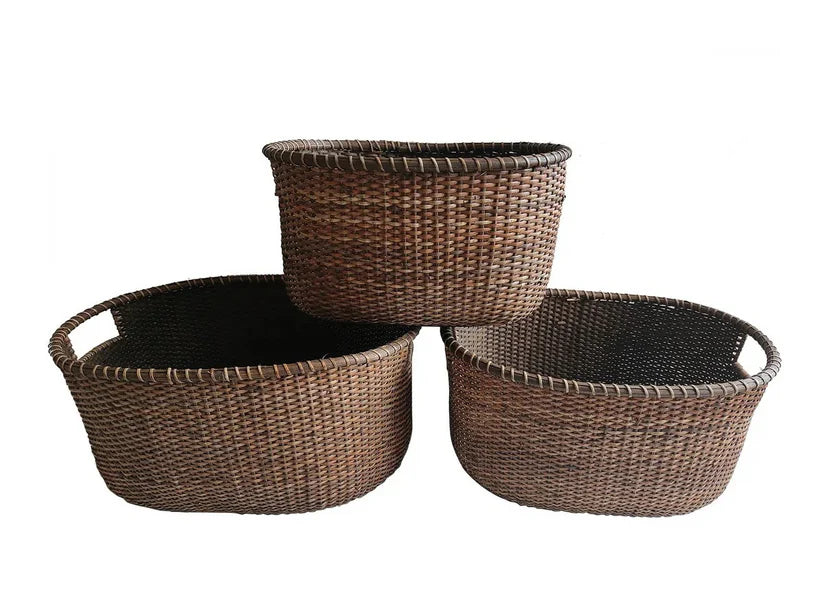 Three woven rattan baskets of different sizes small, medium, and large. 