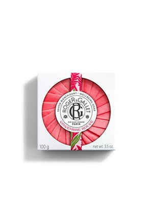 An individual bar of Gingembre Rouge scented shower soap from Roger & Gallet; featuring a circular red rosette paper design on a white background with floral motifs.