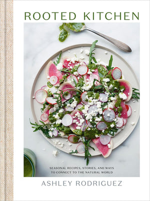 Book cover of 'Rooted Kitchen' with a salad on a plate. Ashley Rodriguez.